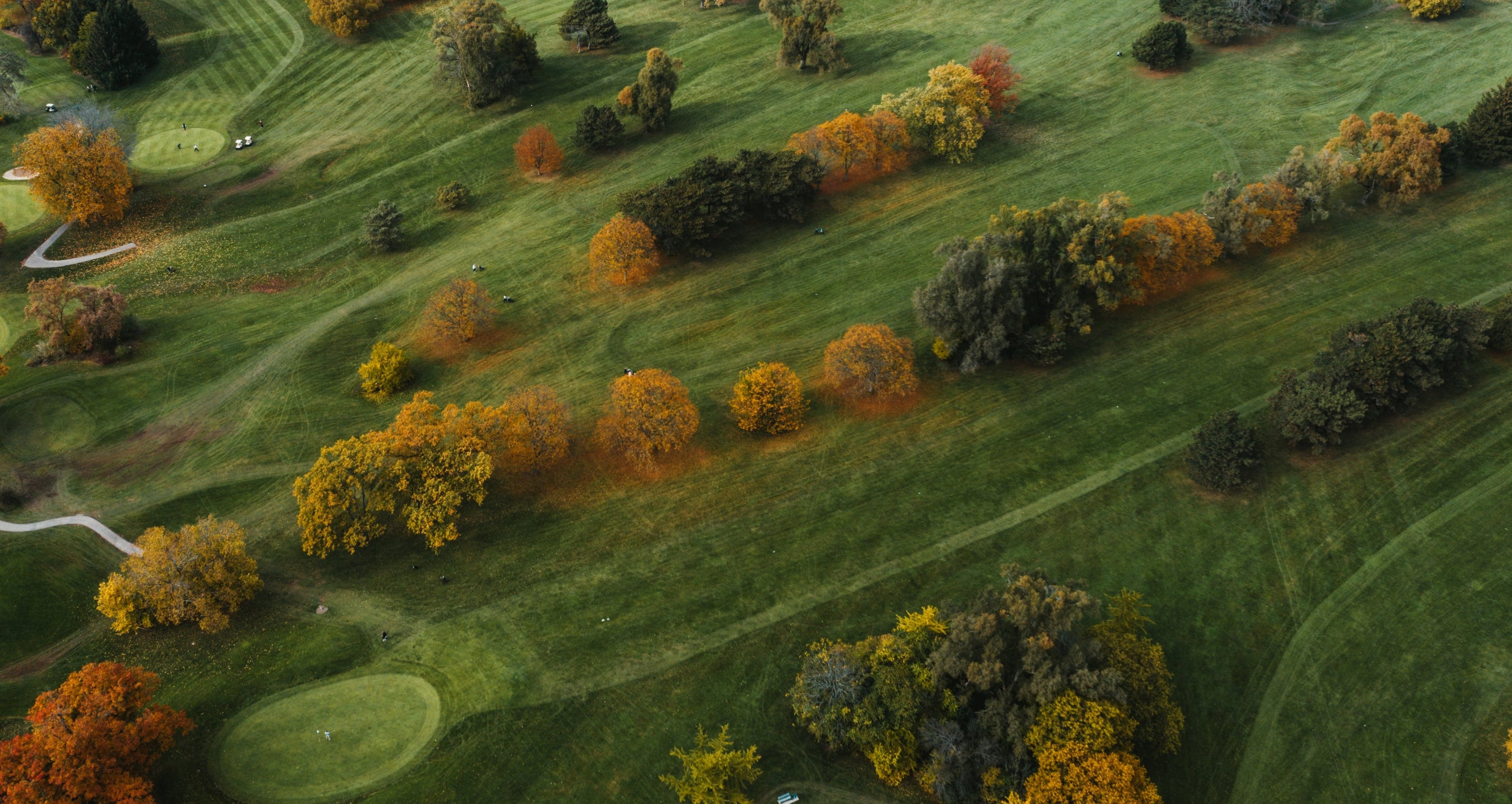Golf course from above showing fairways and greens 